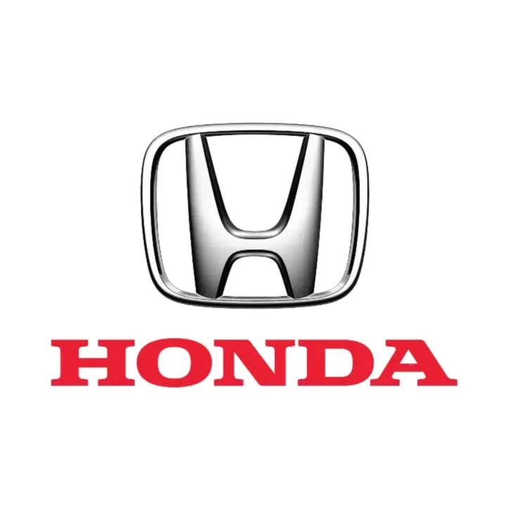 Honda logo with a silver chrome emblem above the red word 'Honda' on a white background.
