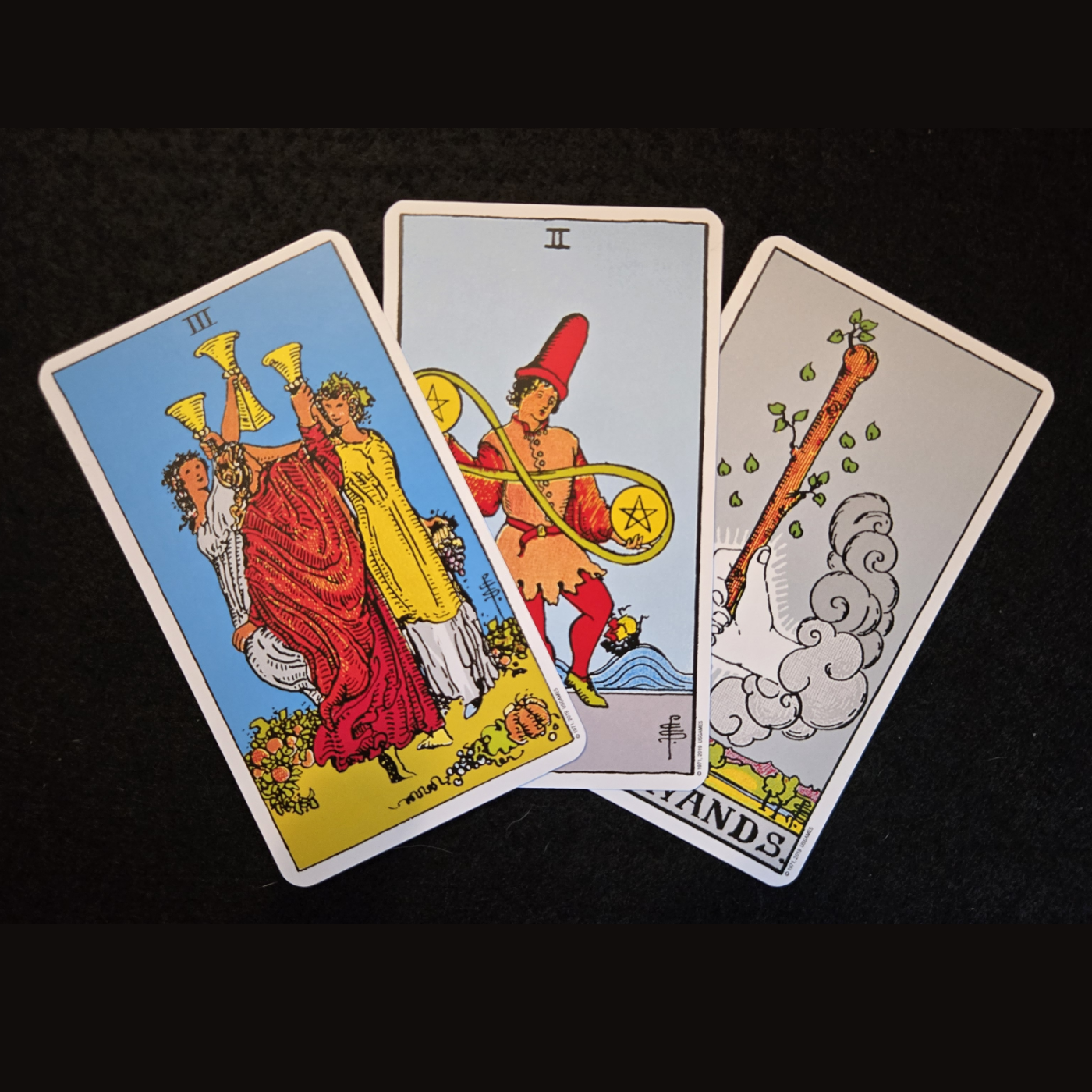 Three tarot cards splayed out to show a high volume of items to be delivered