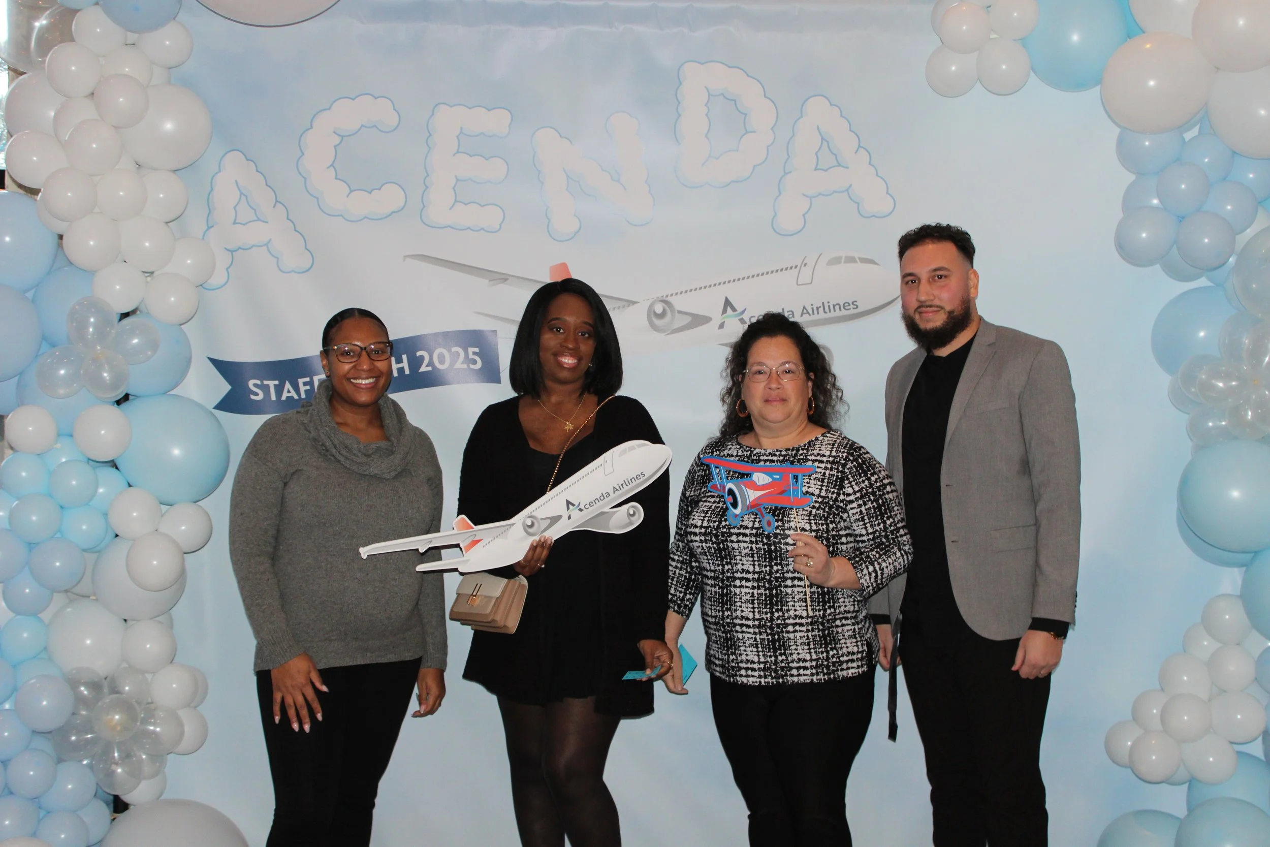 Four members of #TeamAcenda pose at 2025 Staff Bash 