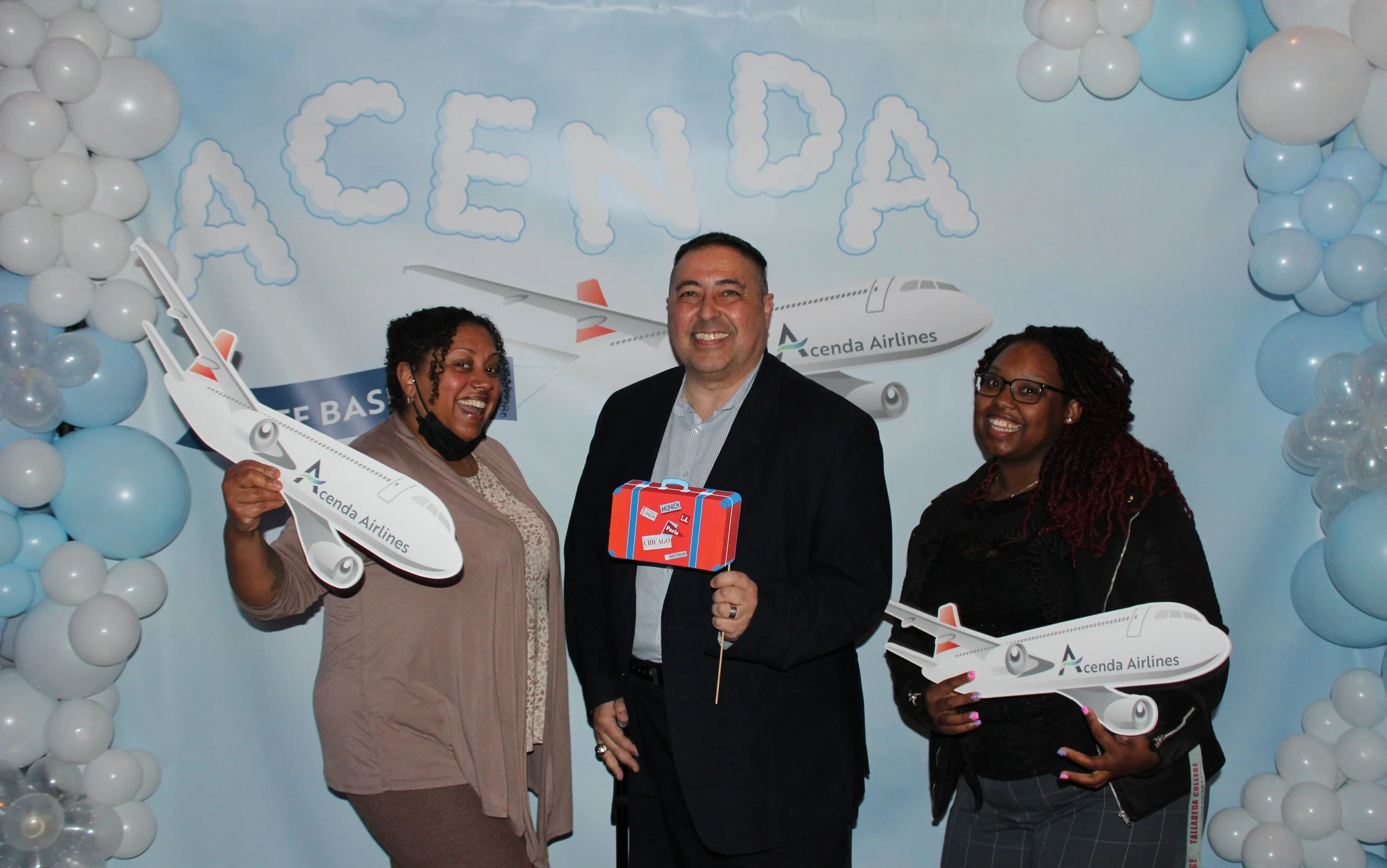 Three members of #TeamAcenda pose at 2025 Staff Bash 