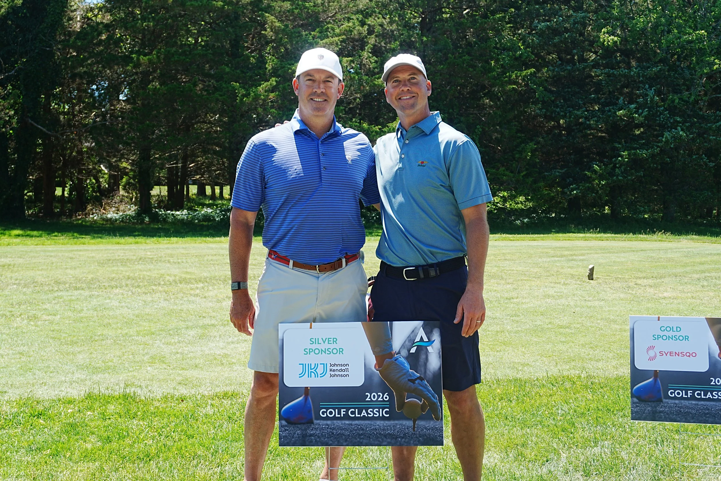 sponsor Johnson Kendall Johnson posing at Acenda's Golf Classic