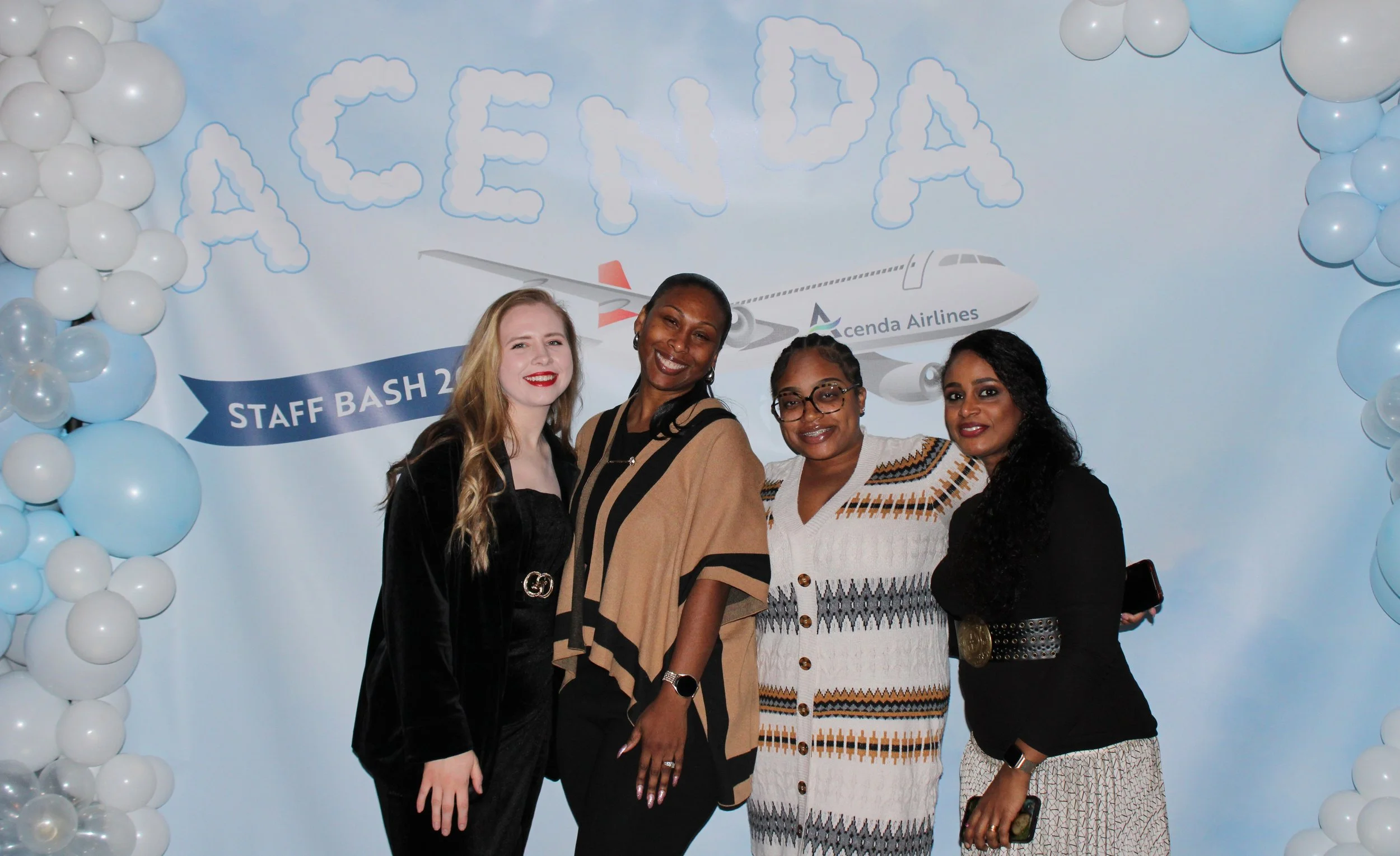 Four members of #TeamAcenda pose at 2025 Staff Bash 