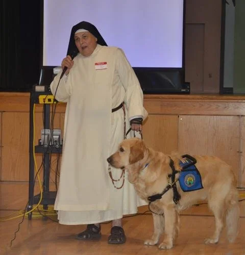  Sister Pauline Quinn, founder of the Prison Pet Partnership Program, spoke at St. Joseph’s Church in Norman in 2014 with her therapy dog Pax while visiting the Friends for Folks program at Mabel Bassett Correctional Center. 