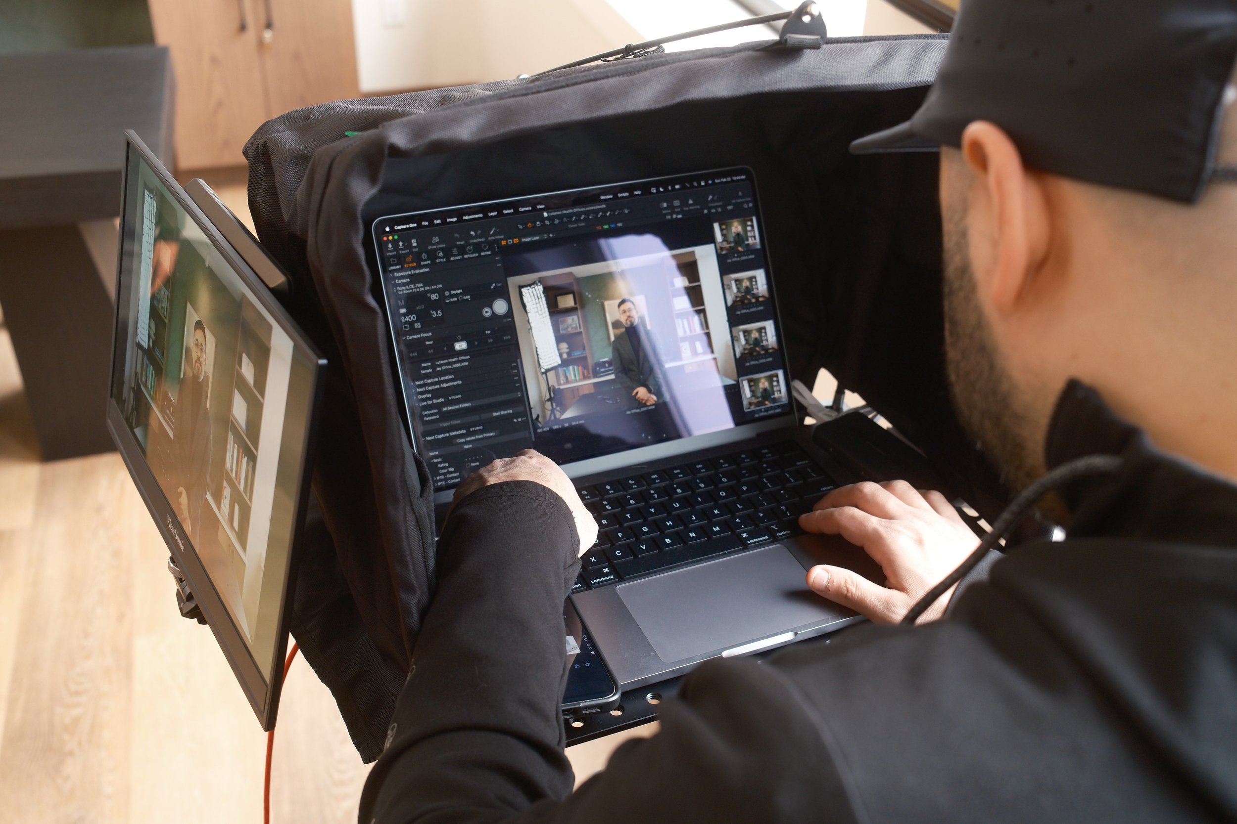Digital Tech working in Capture One with tethered camera workflow and client monitor on a commercial stills set in Boston.