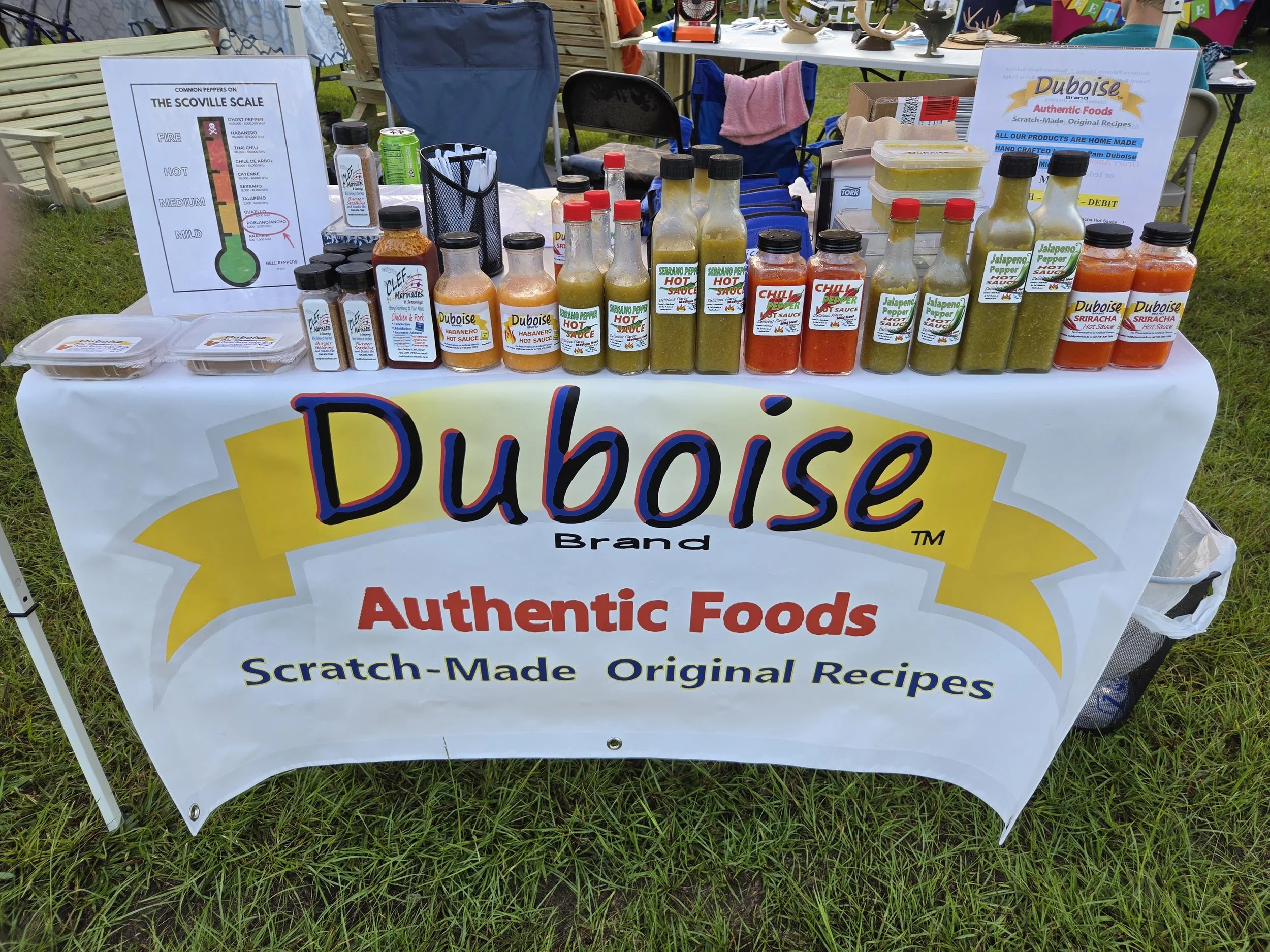 duboise authentic foods product table featuring hot sauces, burger seasonings