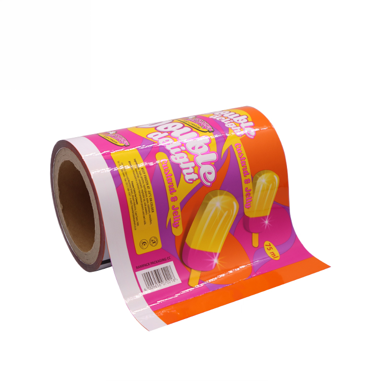 Roll of colorful tattoo wrapping paper with a popsicle design and pink background