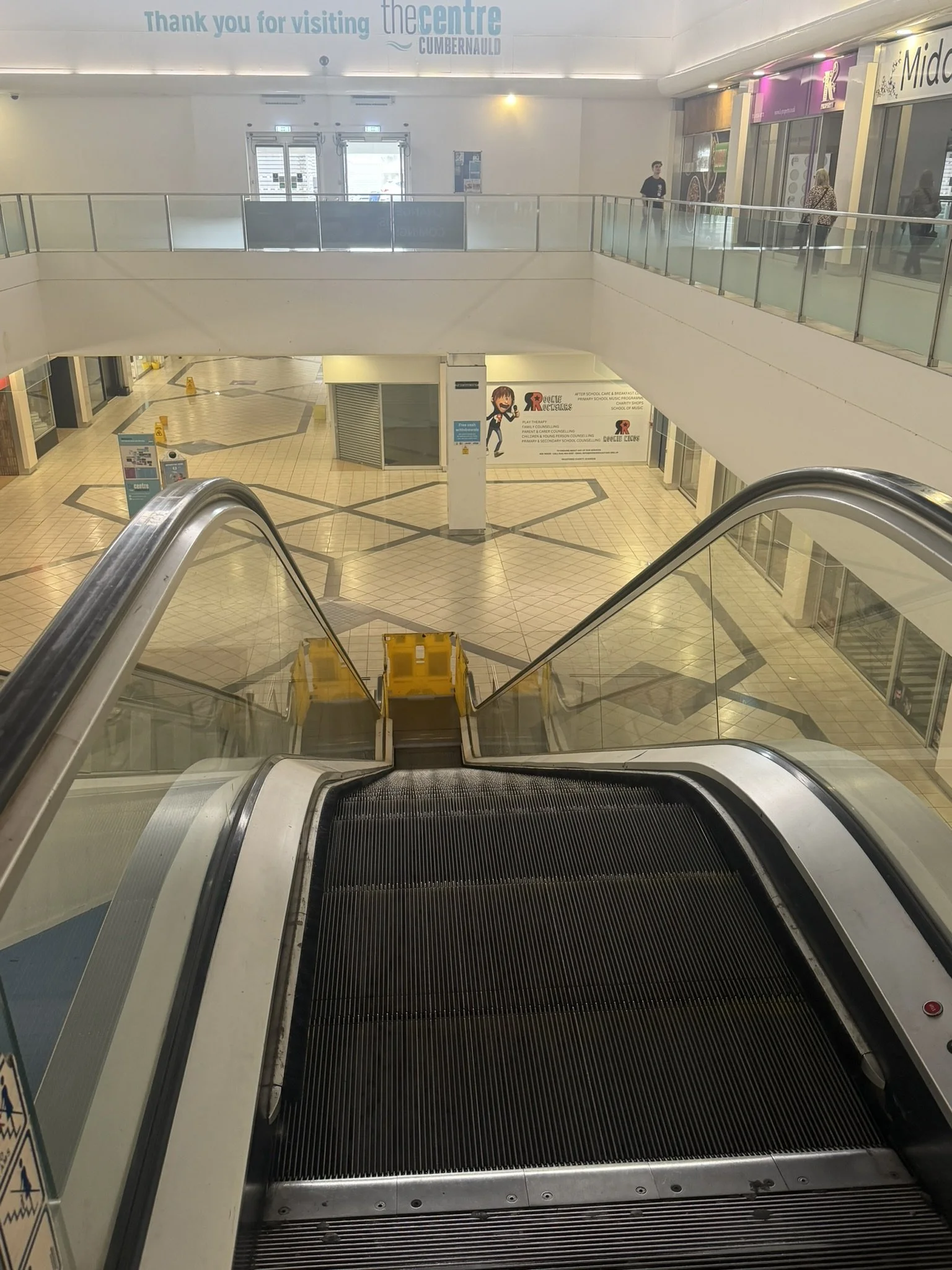Top of escalator looking down into Phase 4 lower mall