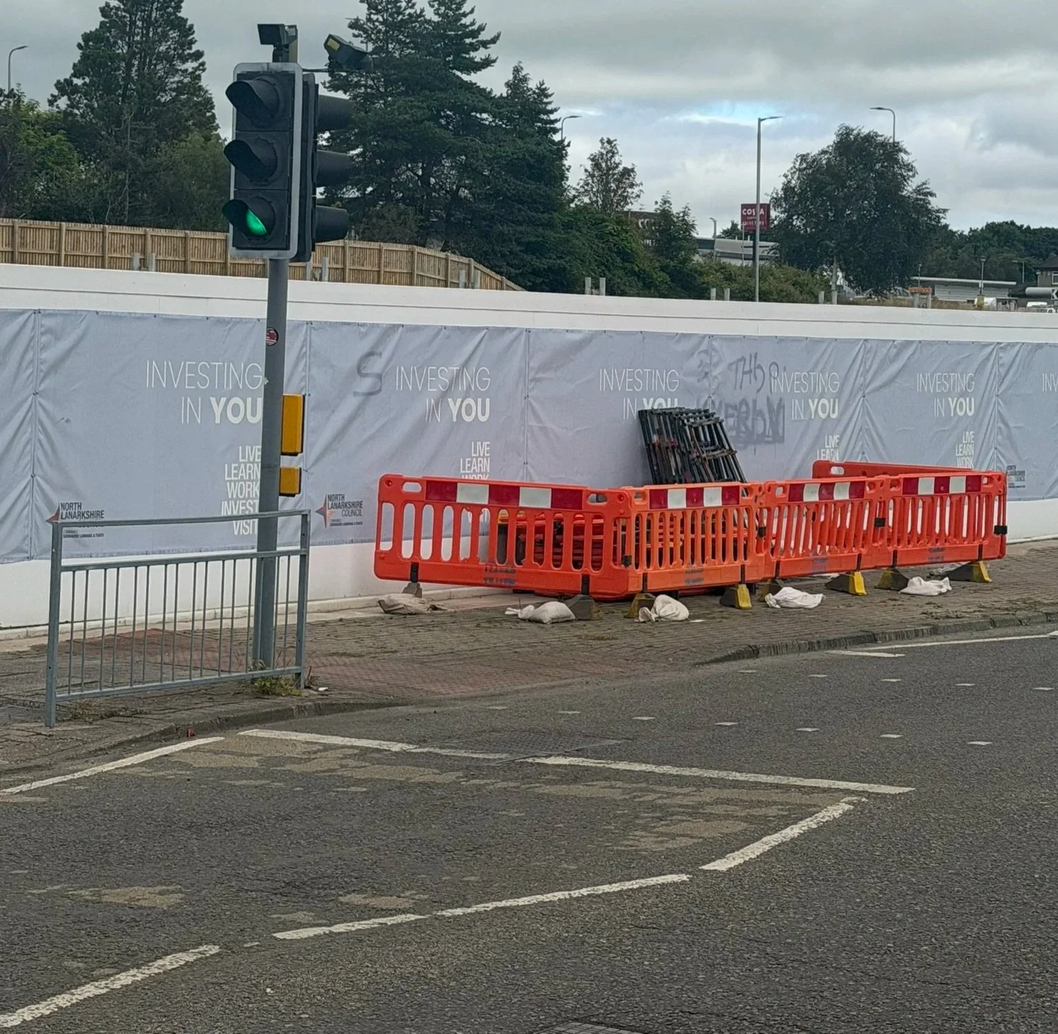 Another shot of the former Fleming House site barrier; part of the grounds are currently being used for car parking. Photo is the author's own.
