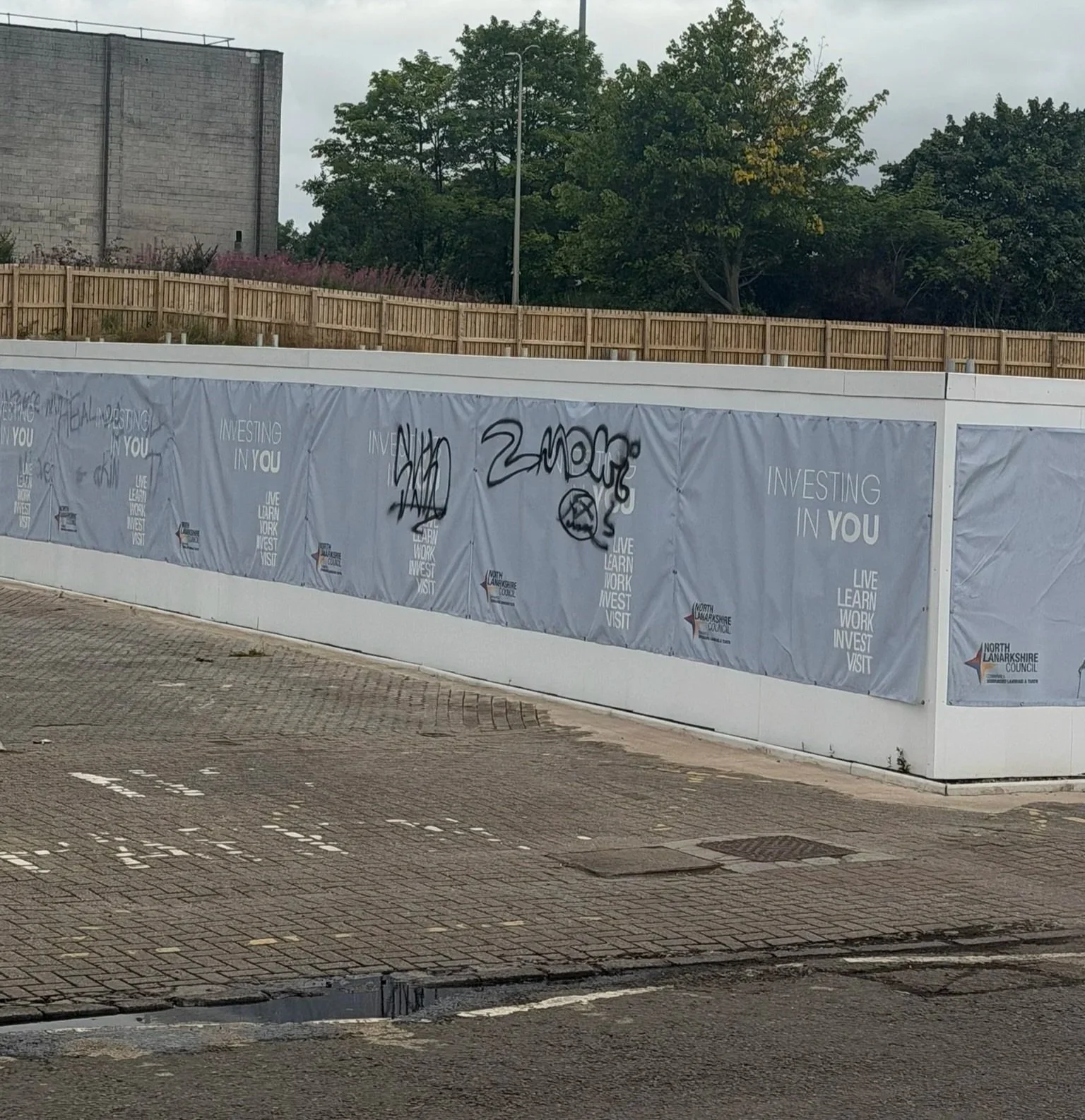 How the former Fleming House site looks currently - with a barrier round it. Photo is the author's own.
