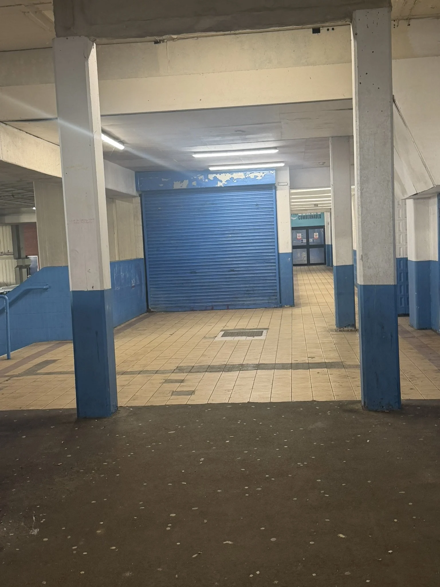 Walkway at car park level of Phase 1 - the blue shutter used to lead to escalators to 2nd floor