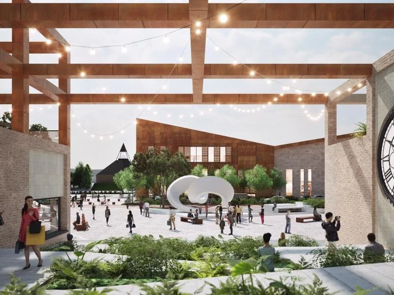 Retail area and new Town Square, featuring St. Enoch Clock; Town Hub and St. Mungo's Church are in the distance. Taken from NLC website at https://www.northlanarkshire.gov.uk/regeneration-and-investment/towns-and-communities/cumbernauld-town-centre-r