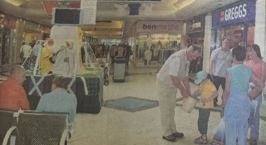 Shot of the Phase 4 mall showing Greggs and Bon Marche, July 2016, taken from Cumbernauld News (held in Cumbernauld Library)