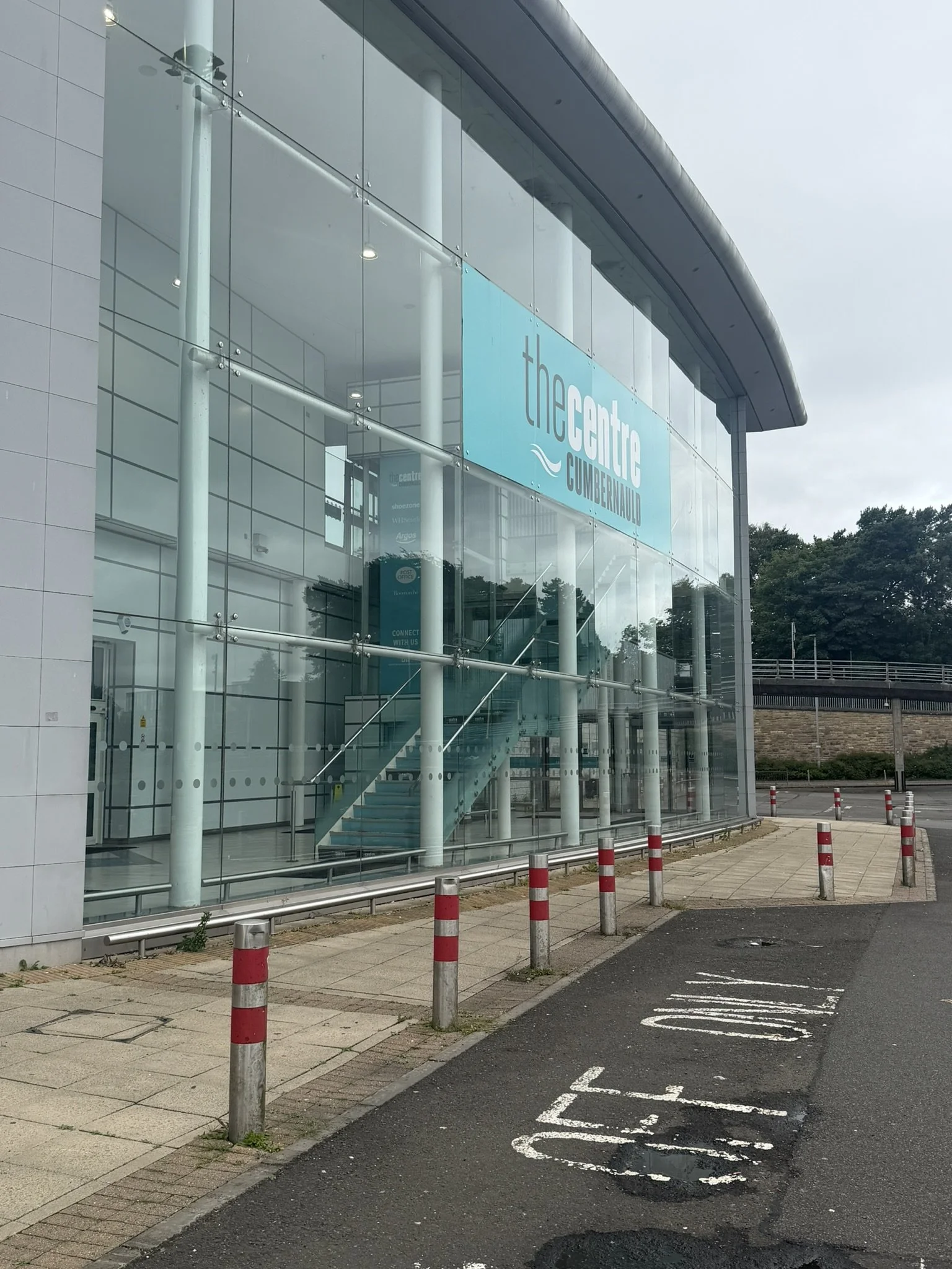 Exterior of glass atrium entrance to Phase 4 mall