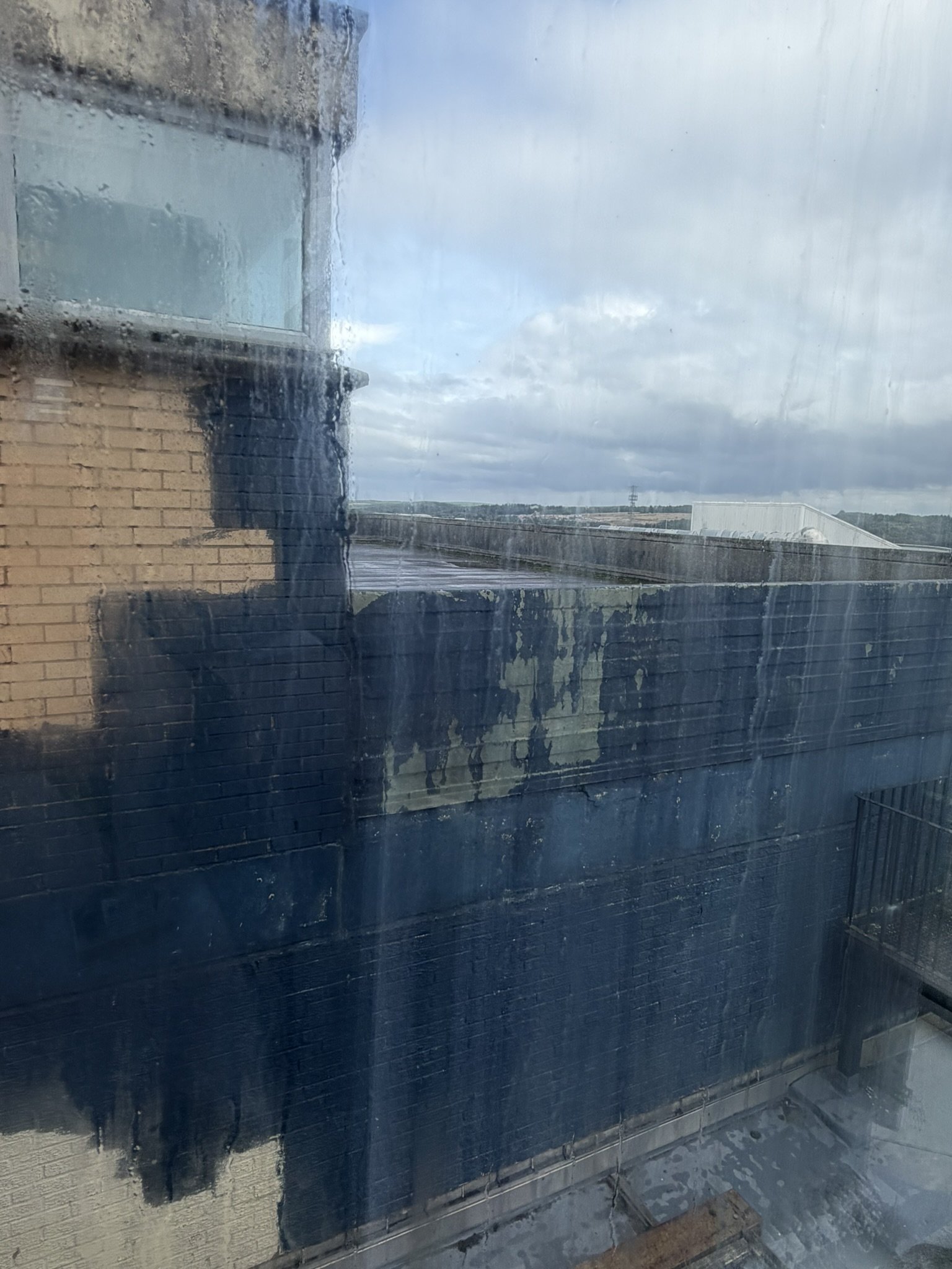 Wall of Phase 1 building (half-painted)