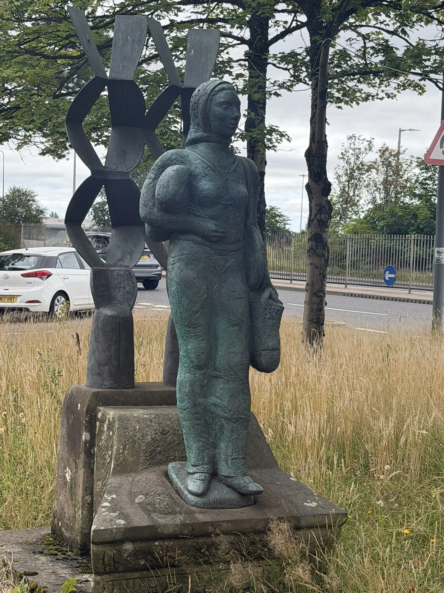 The Shopper statue, now located outside Phase 4 mall