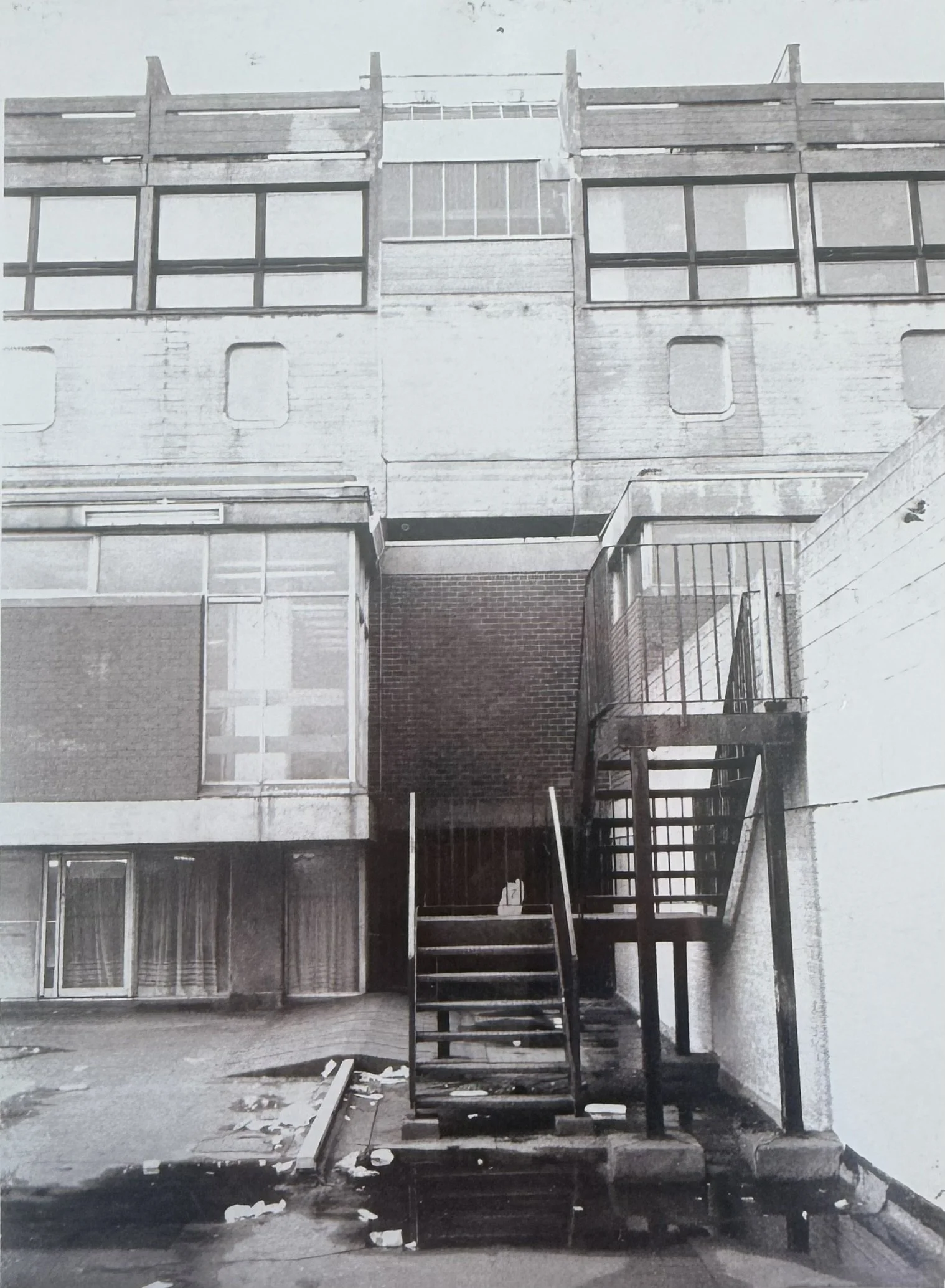 Puddles at the bottom of fire escape stairs