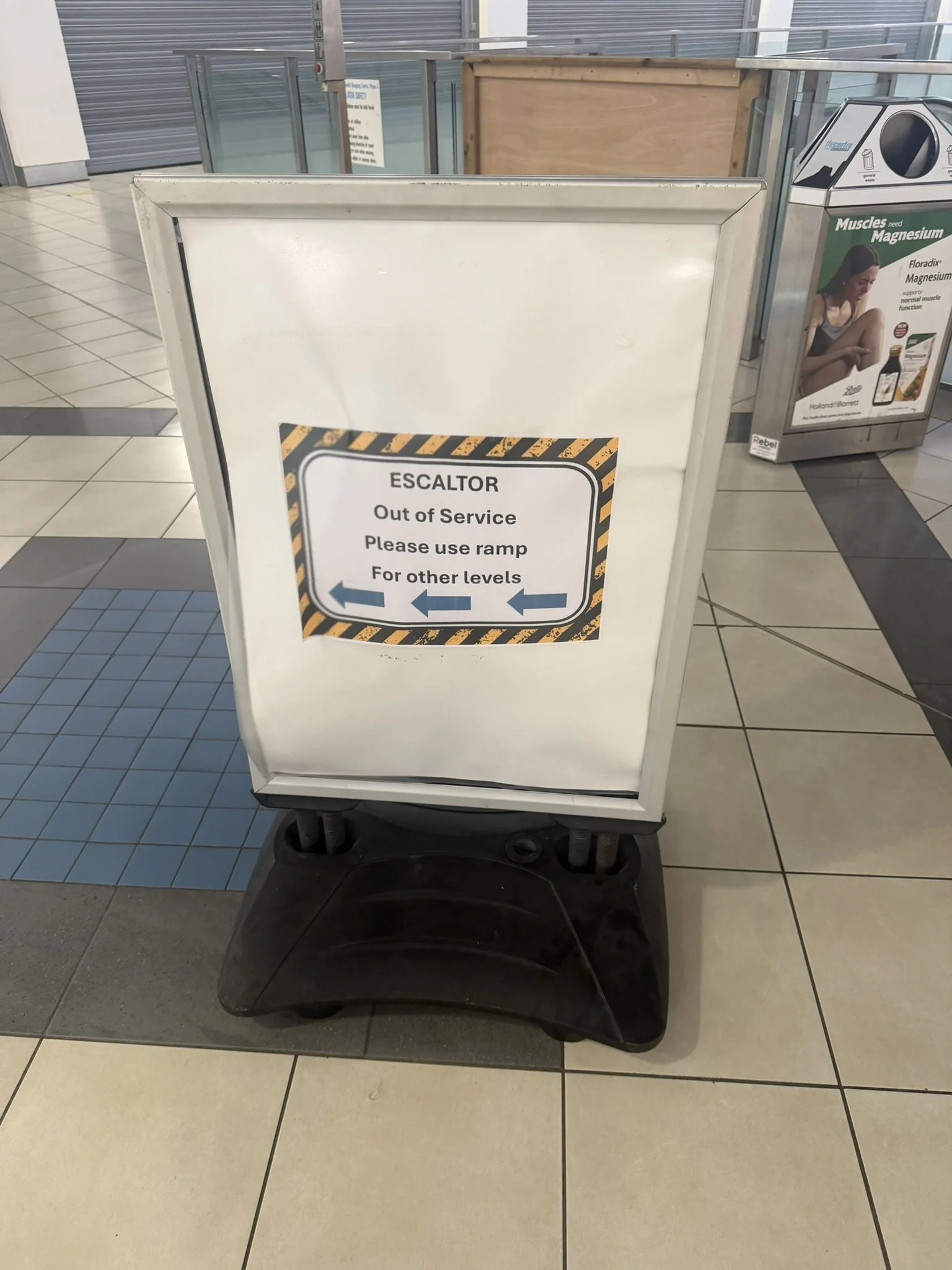 "Escaltor out of service" sign