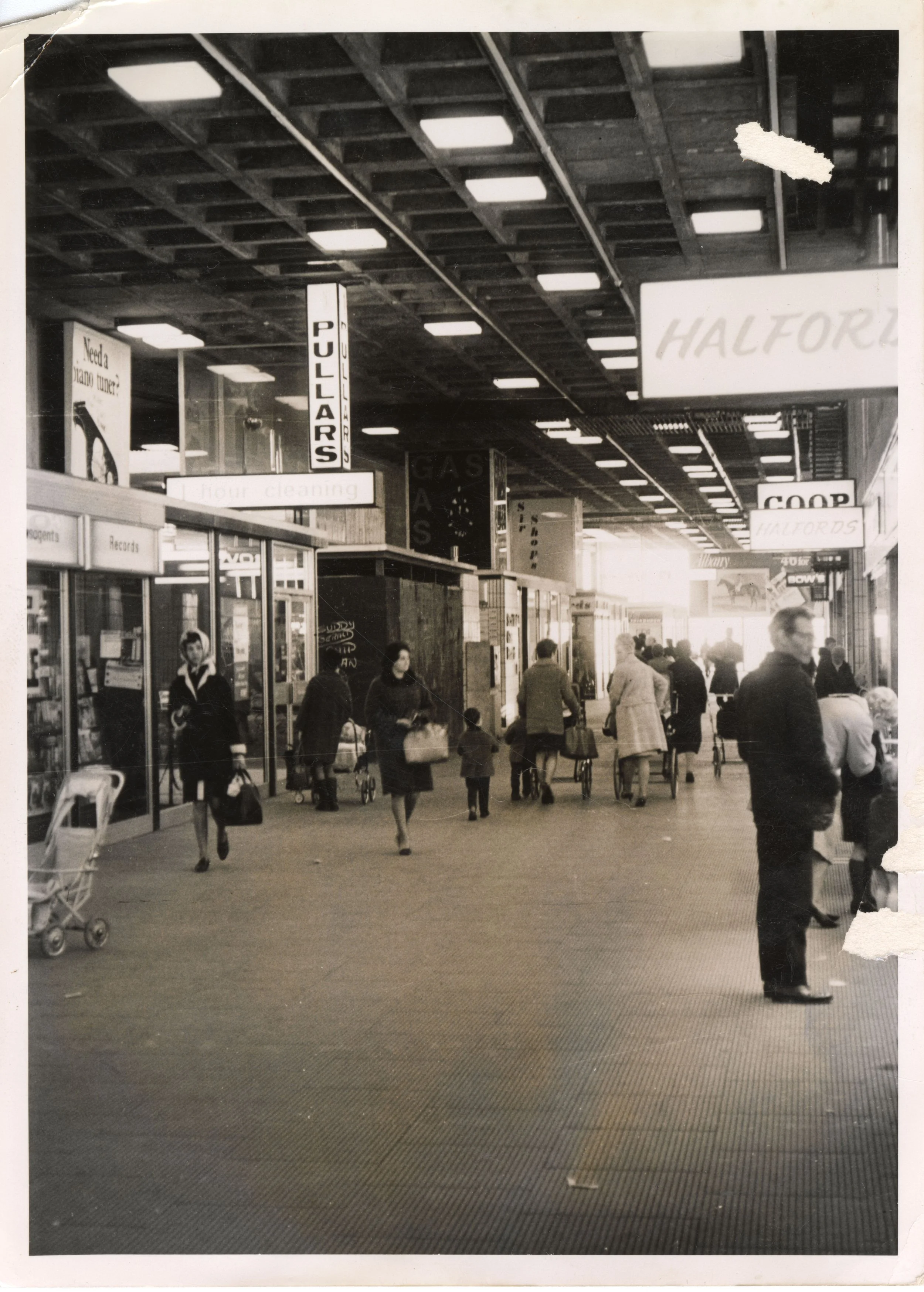 Phase 1 mall showing Halfords, Co-Op, Pullars and more. Photo taken from CDC Collection, held in NLC Archives.