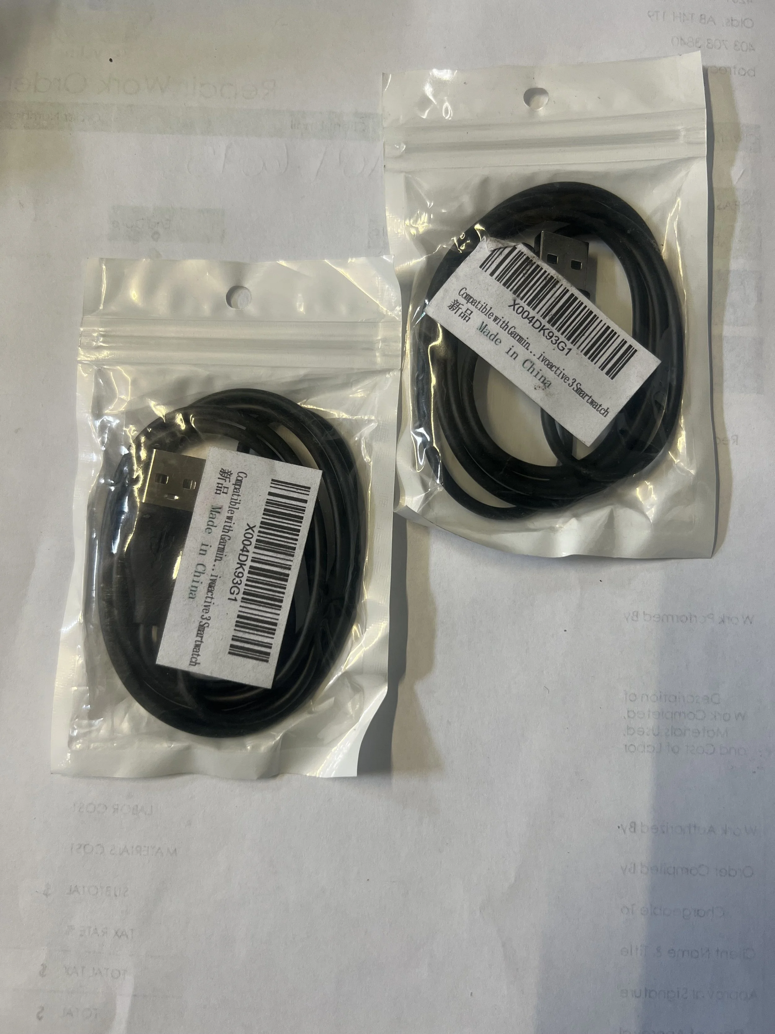 Aftermarket replacement charging cable for Garmin smartwatches.
