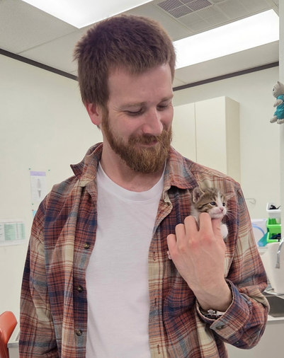 ACES veterinary team member holding a kitten at the La Porte animal hospital