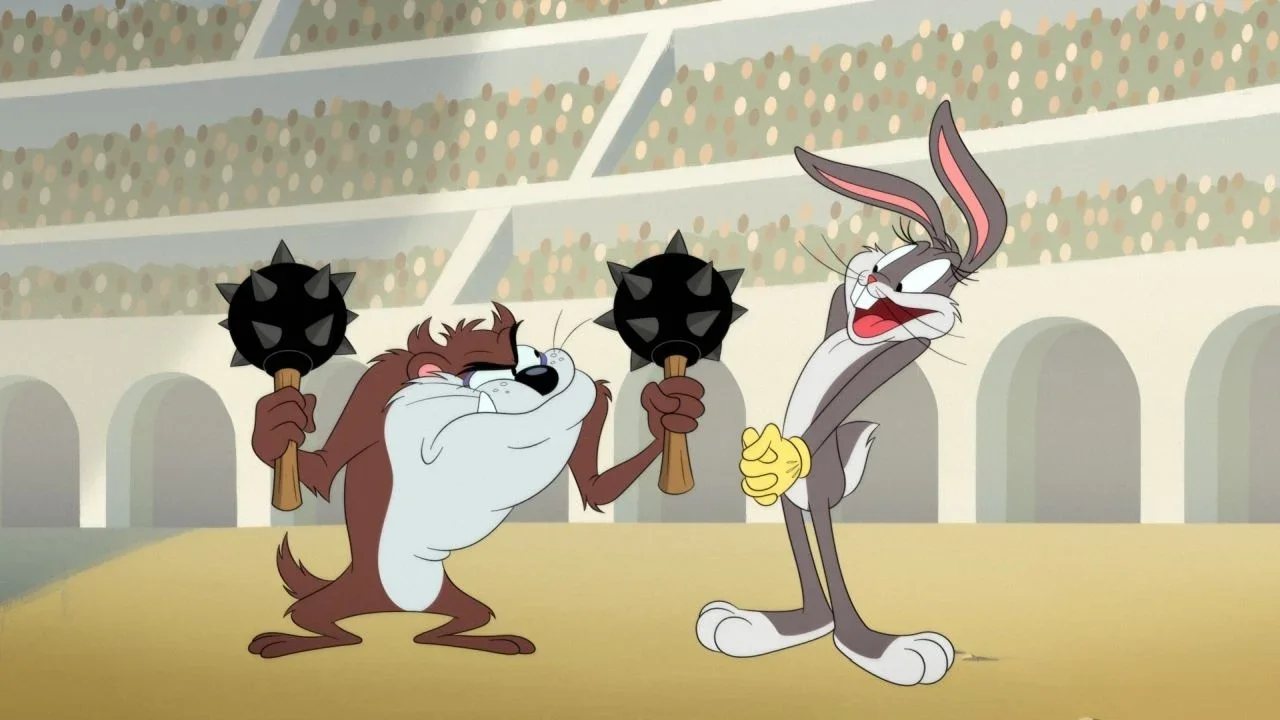 The Tasmanian Devil holding two spiked maces next to Bugs Bunny posing playfully in an arena.