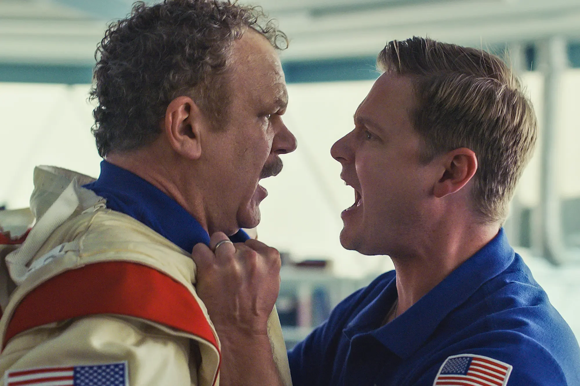 John C. Reilly and Tim Heidecker grabbing each other's collars and shouting during a confrontation in Moonbase 8.