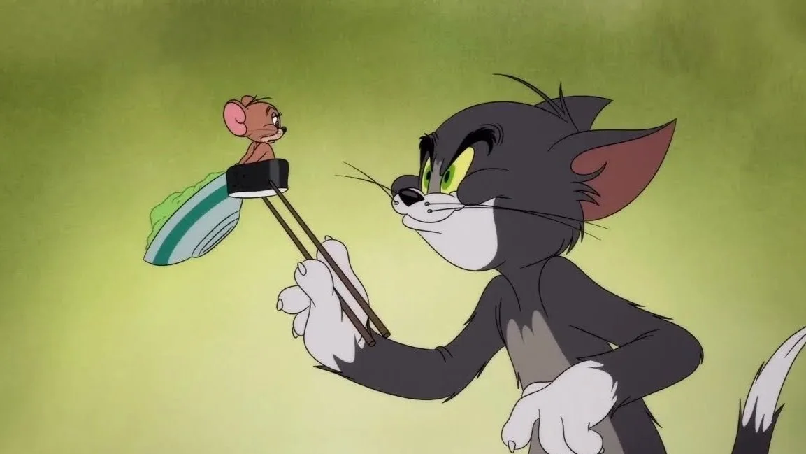 Tom the cat holding chopsticks with Jerry the mouse sitting on a piece of food.