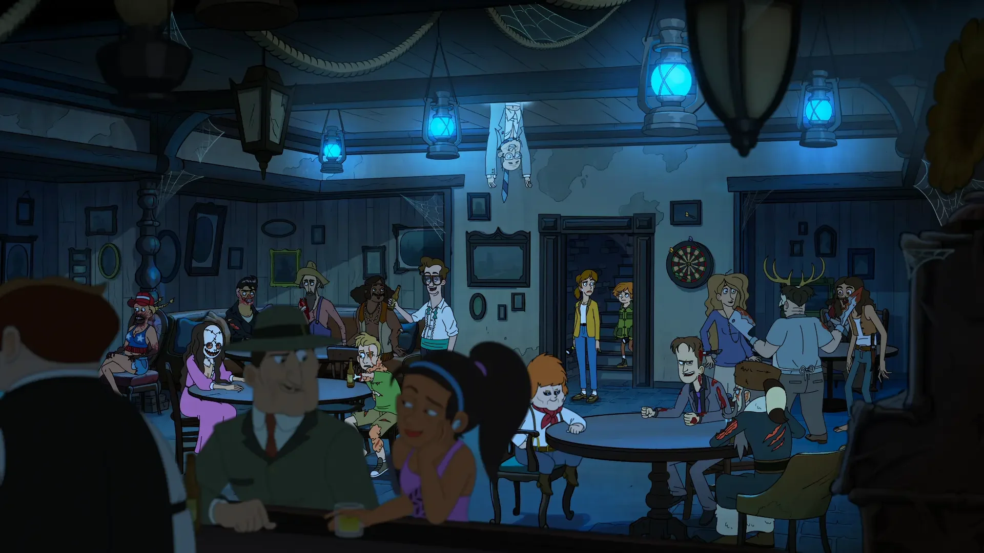 Crowded bar inside a haunted hotel filled with various ghost patrons sitting at tables under blue lanterns.