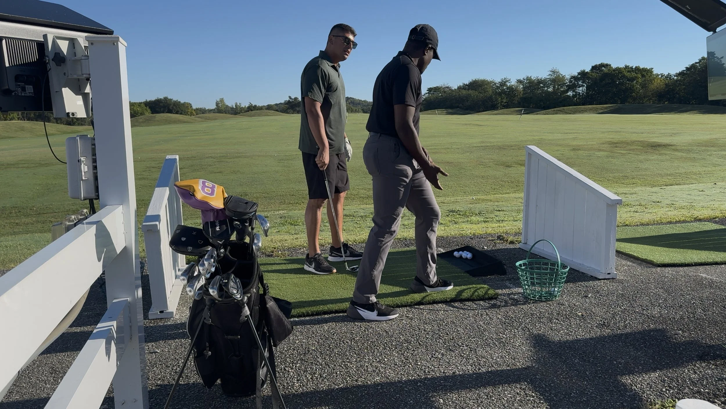 Physical therapist demonstrating a knee movement while a client practices the movement with guidance.