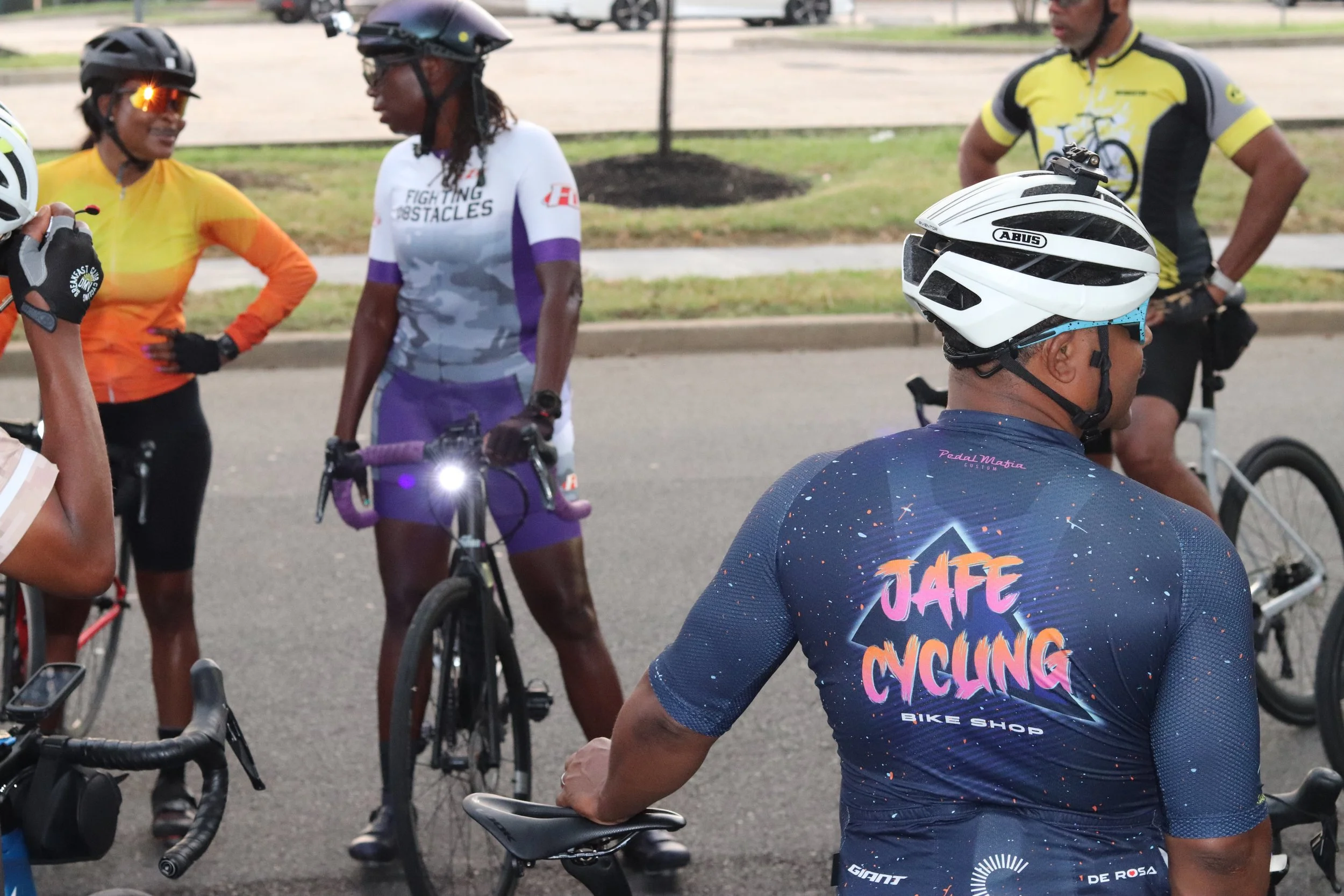 Group of cyclists talking together before a group ride.