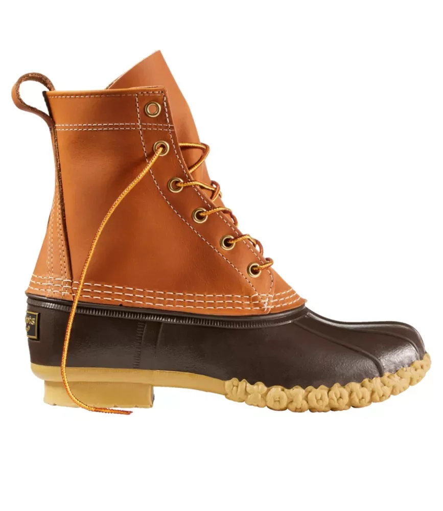 A hybrid boot combining a leather work boot and a rubber rain boot, featuring a brown leather upper, dark brown rubber lower, and a beige sole with a rugged, textured pattern.