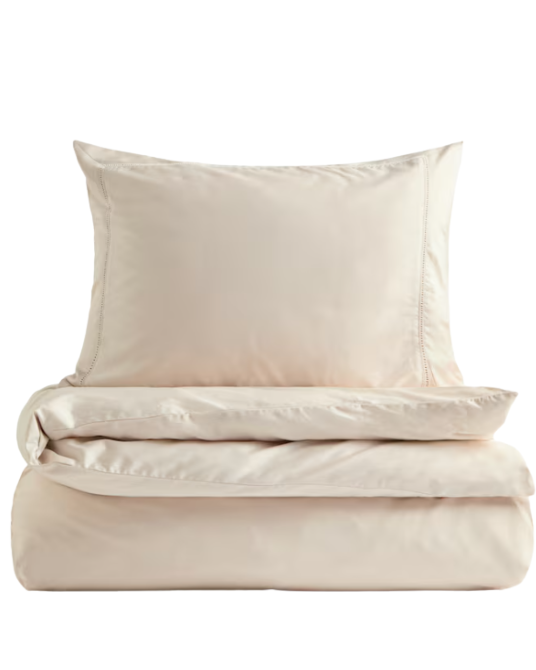 Stack of white bed sheets and pillowcases with light beige vertical stripes.