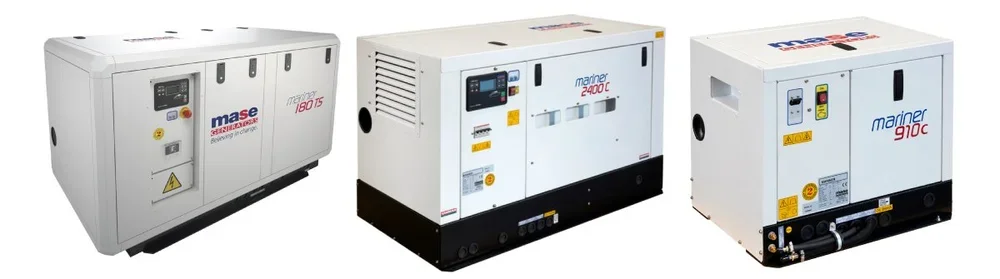 Three large industrial air compressors, side by side, with digital display panels and warning labels.