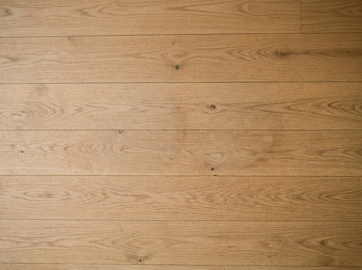 Light-colored wooden floor with visible wood grain and knots.