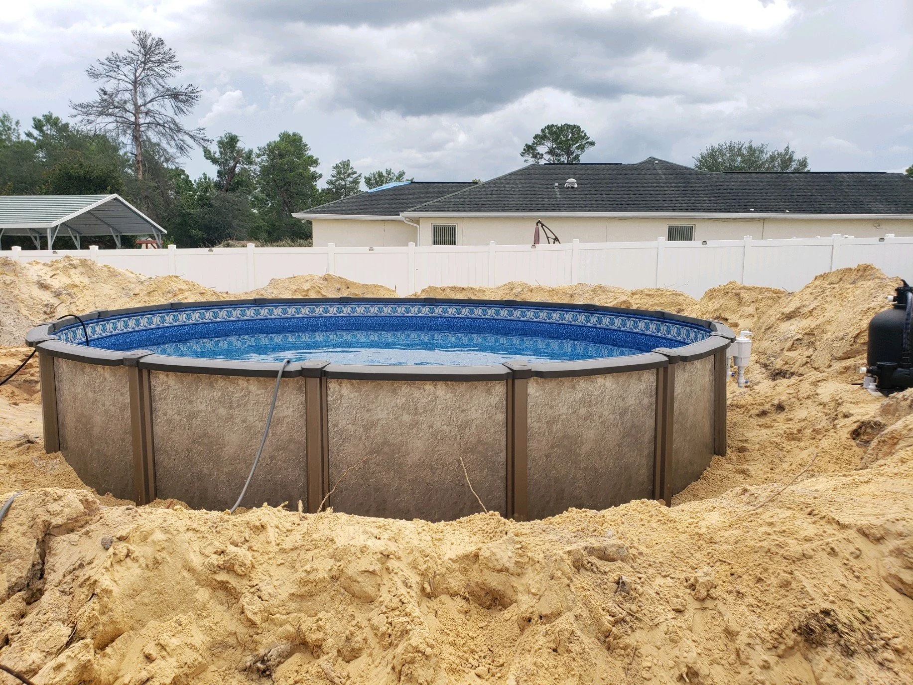 Above-ground swimming pool installation in process. 