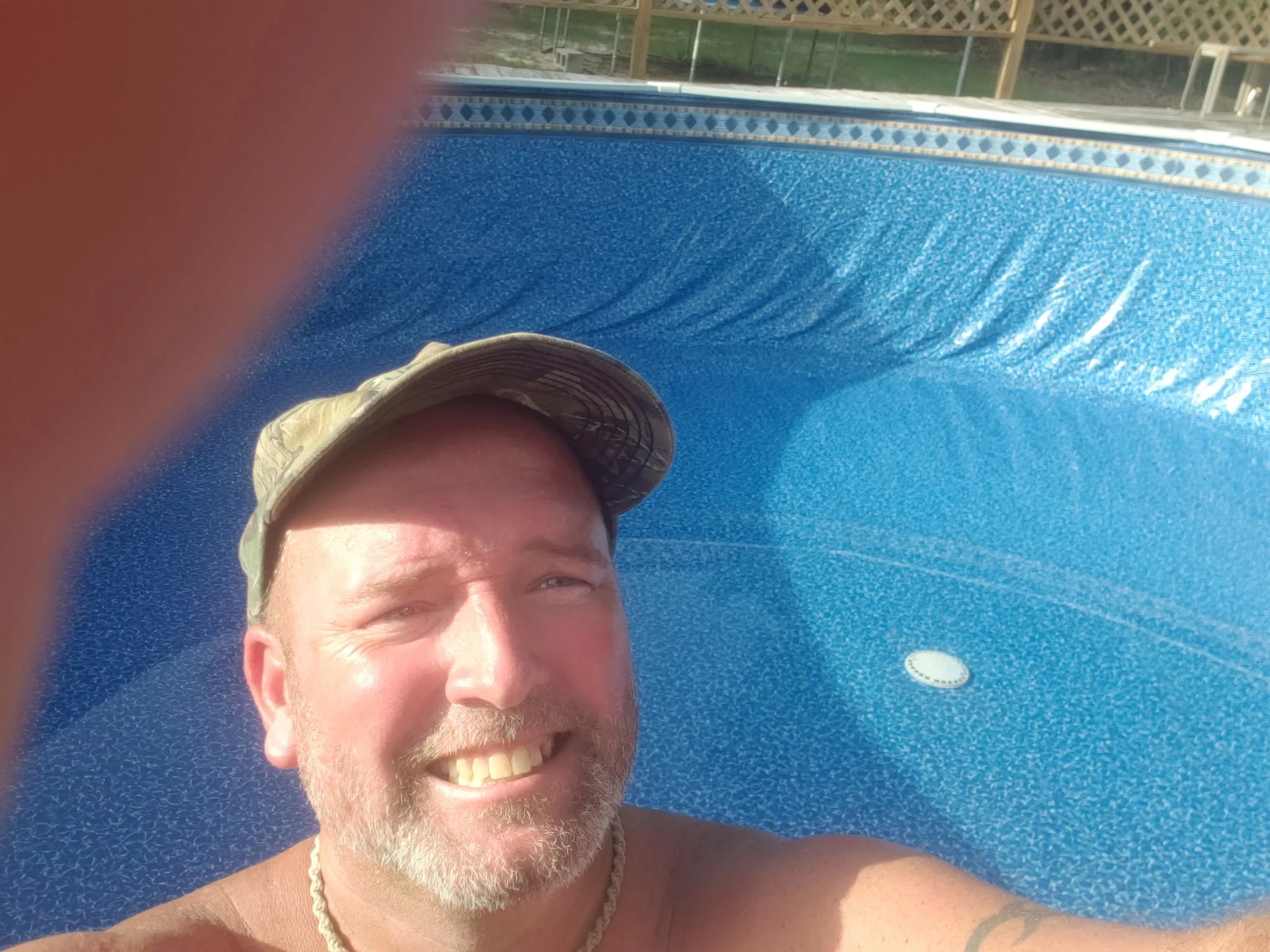 Pool installer working inside a newly lined above-ground swimming pool.