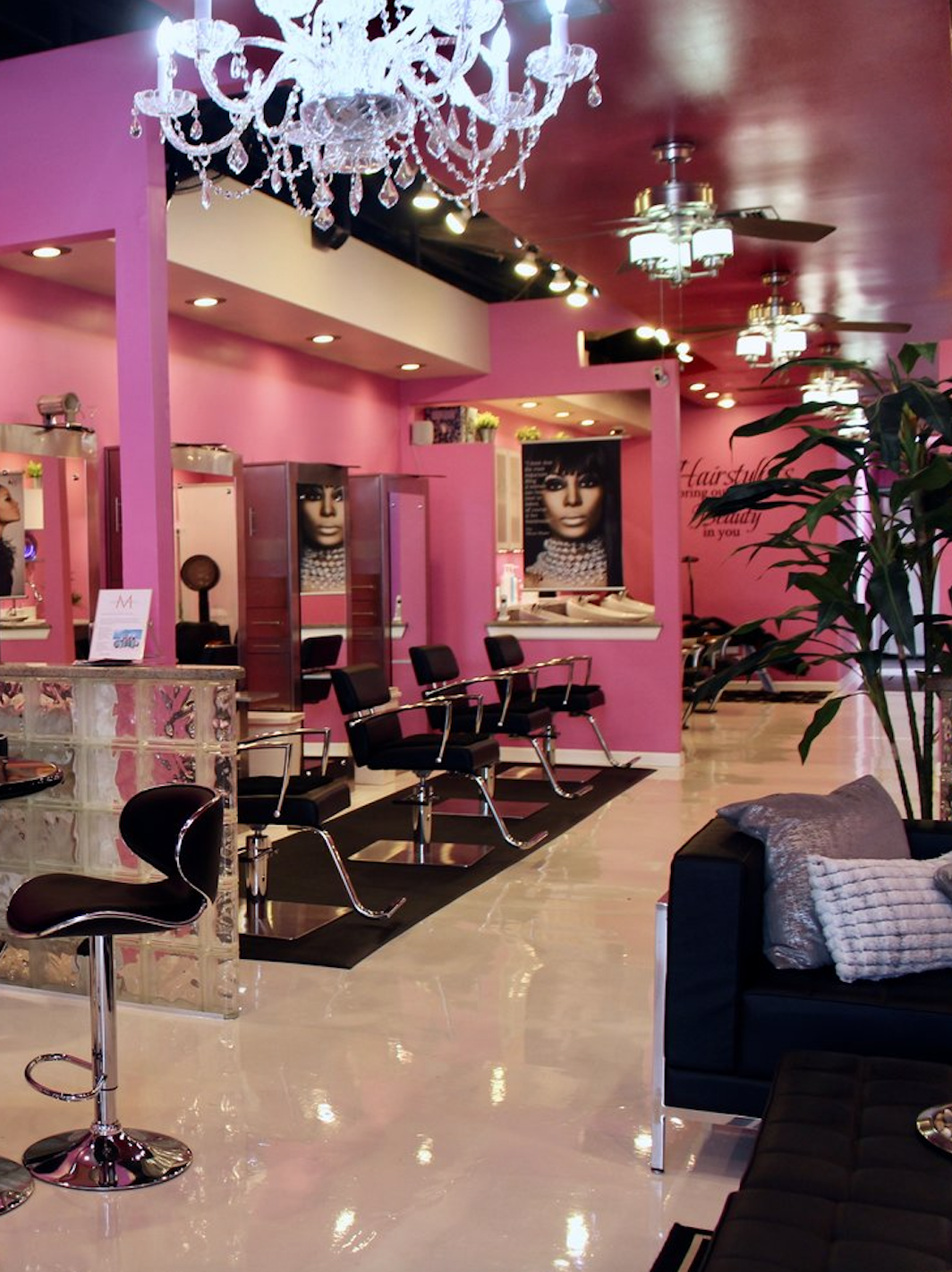 Interior of Salon de Weave featuring styling stations and the salon’s signature pink decor.