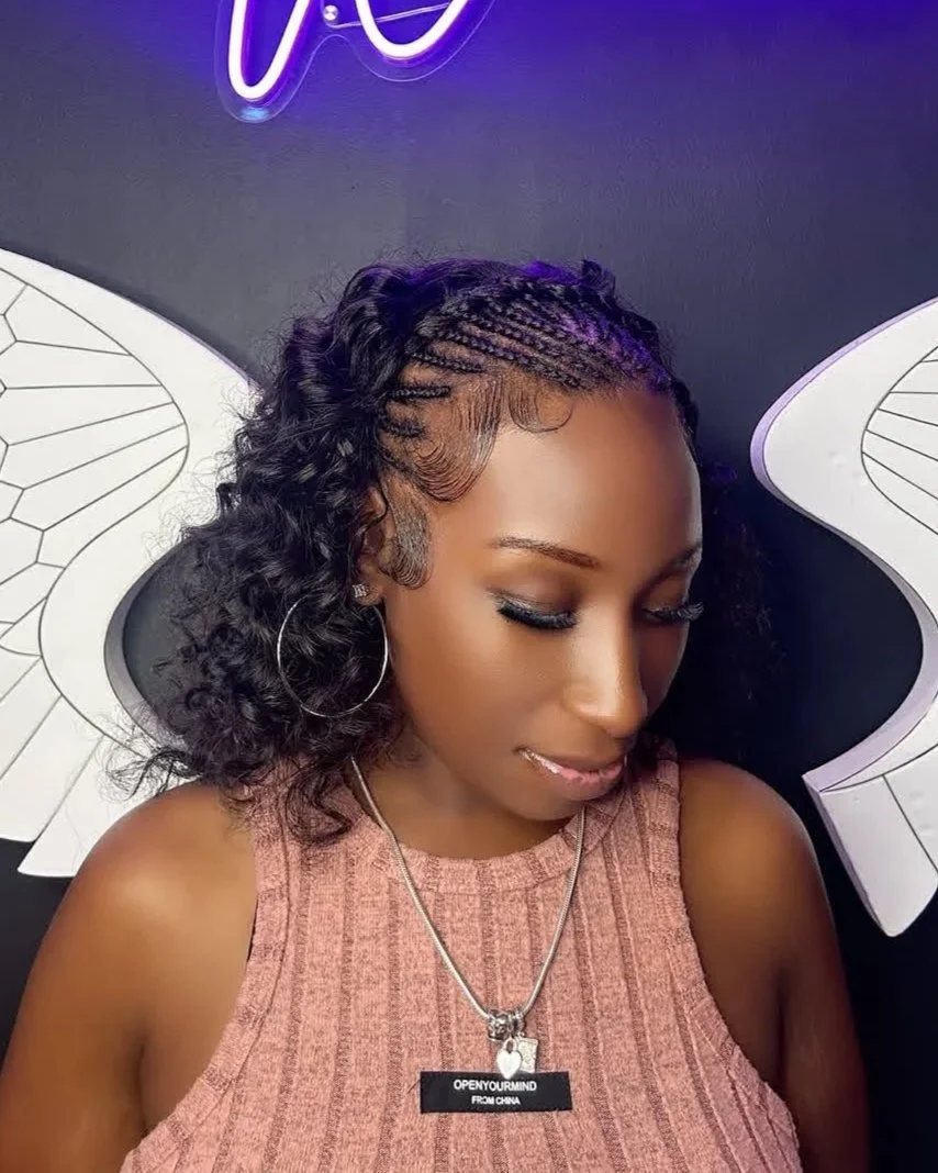 Braided hairstyle with curls and styled edges at Salon de Weave