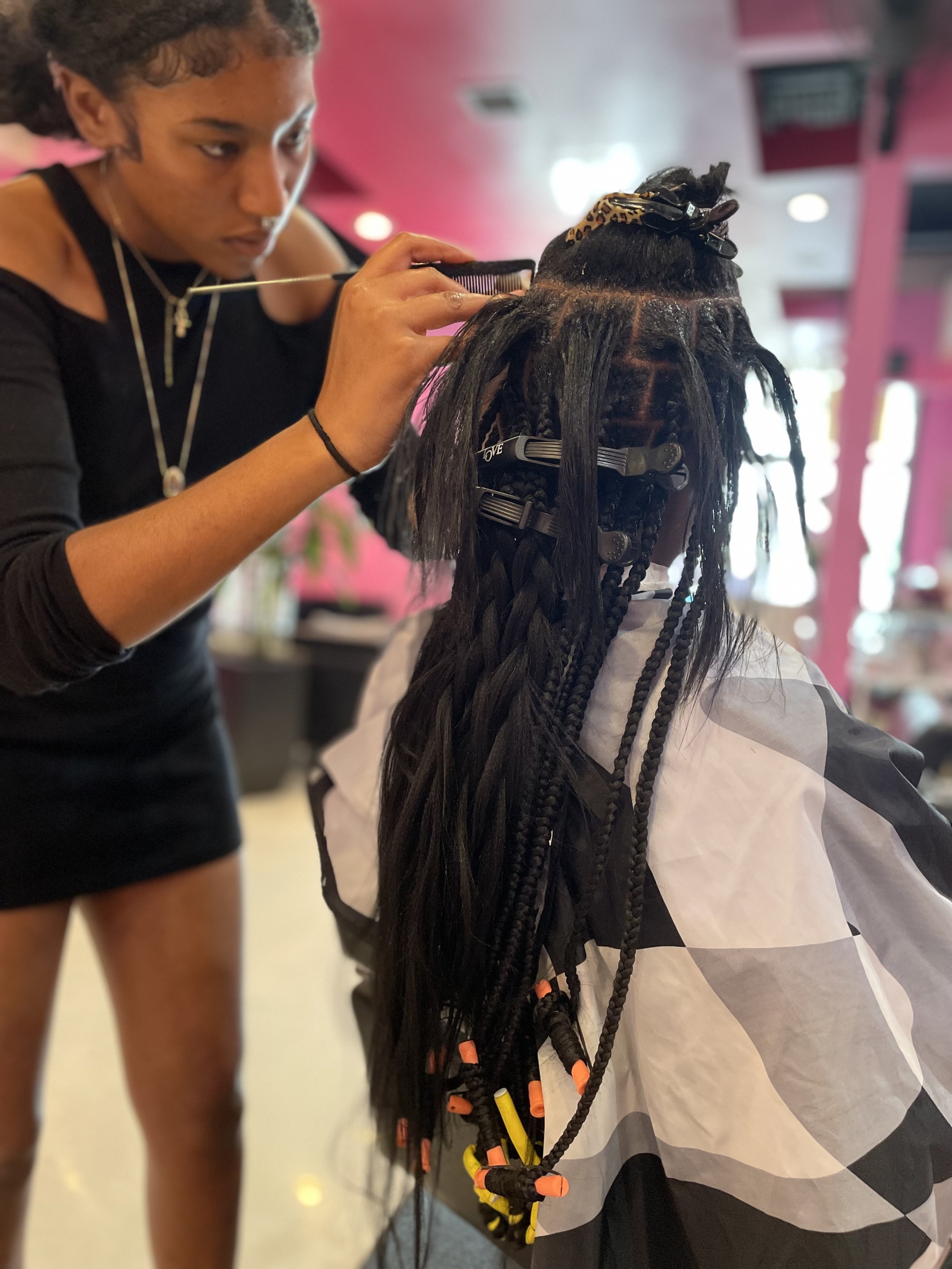 Braiding service in progress at Salon de Weave