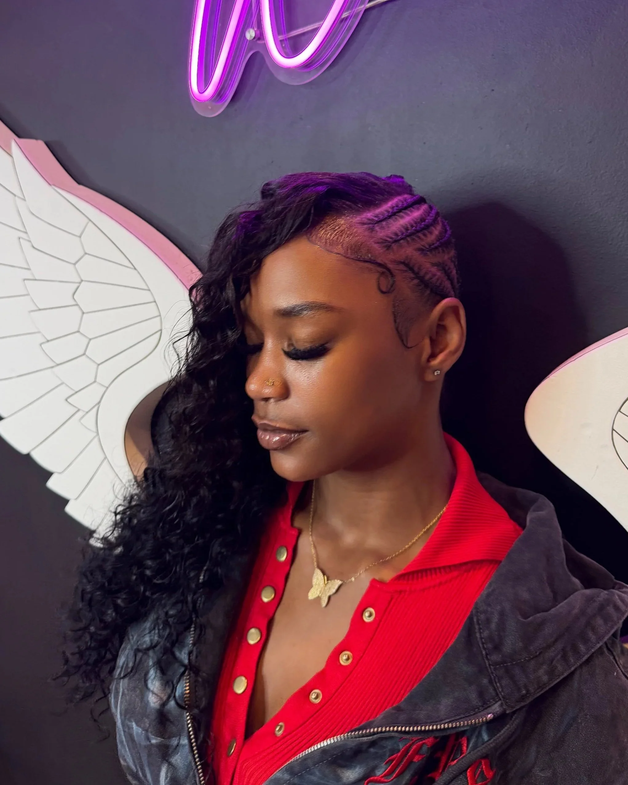 Side braids with long curly hair at Salon de Weave