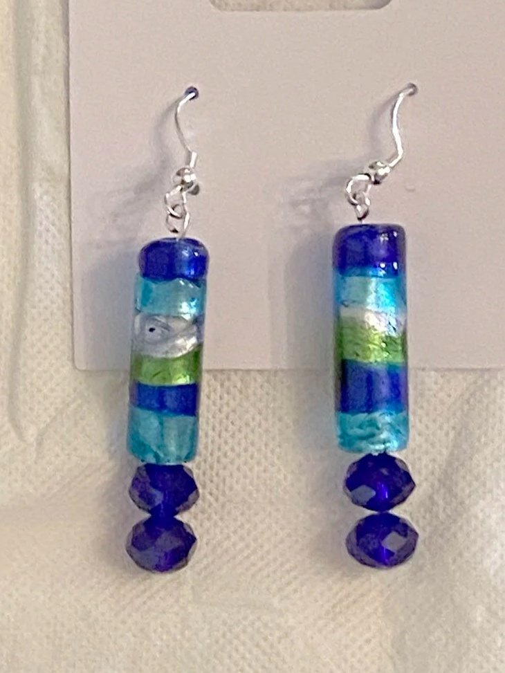 Colorful beaded dangle earrings with silver hooks, featuring cylindrical and faceted beads in blue, green, and silver.