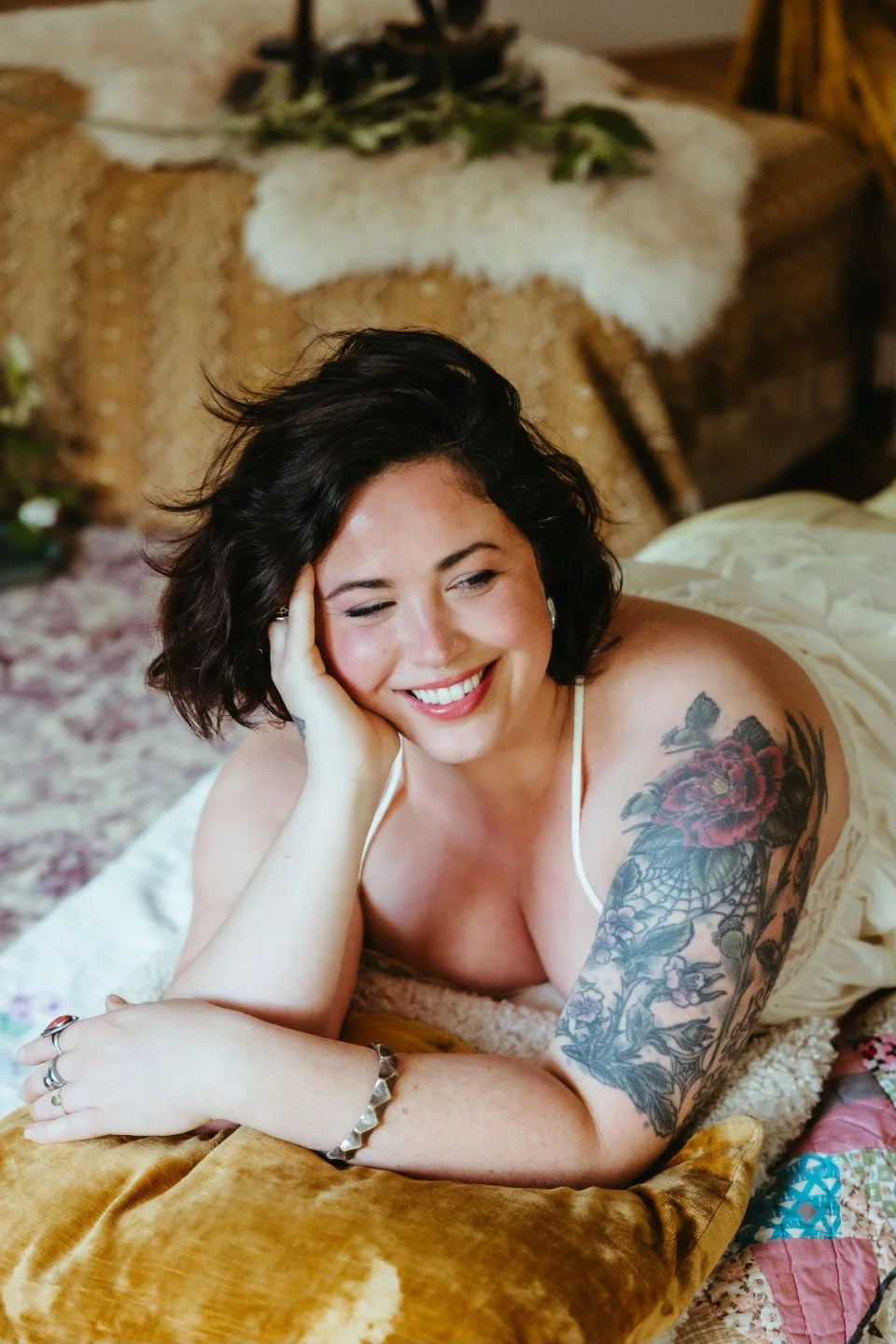 Zoë Kessler, Ayurvedic health coach and bodyworker, smiling in nature