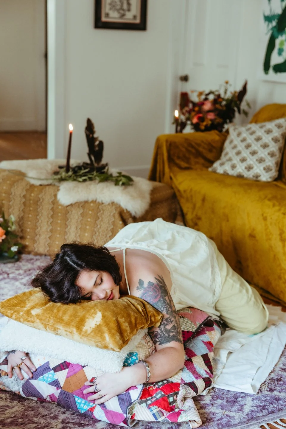 Woman lying on belly on cushions in yoga pose