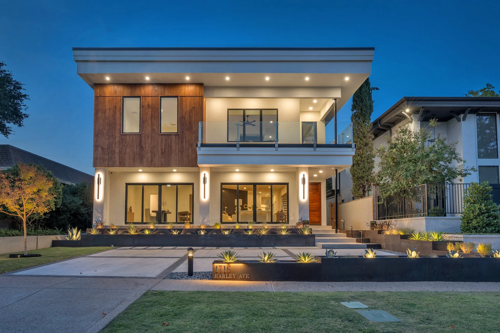 Modern residential exterior photographed at twilight.