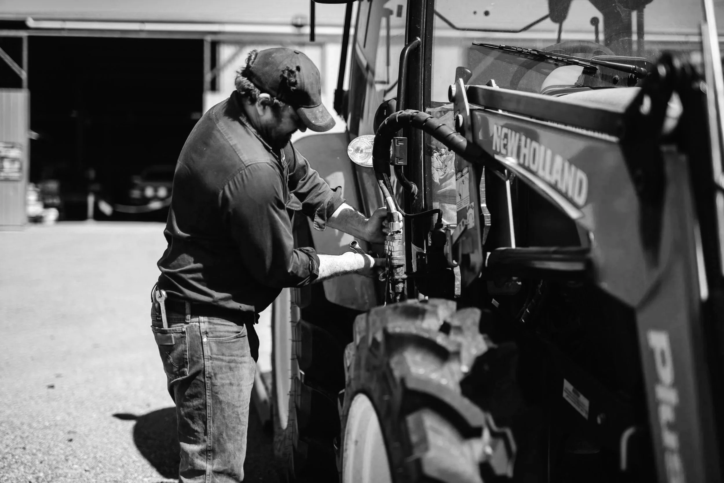 A mechanic working on a tractor near Boggabri, regional NSW
