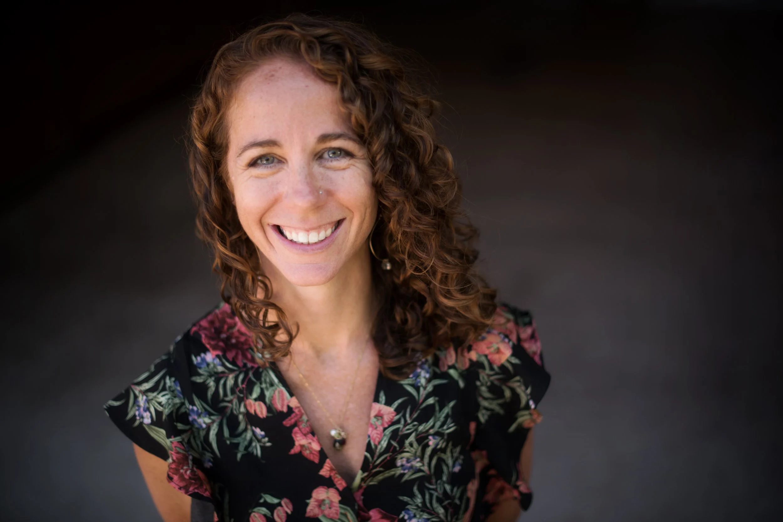 Headshot of Erinn Zavaglia, therapist and founder of A Place by the Fire
