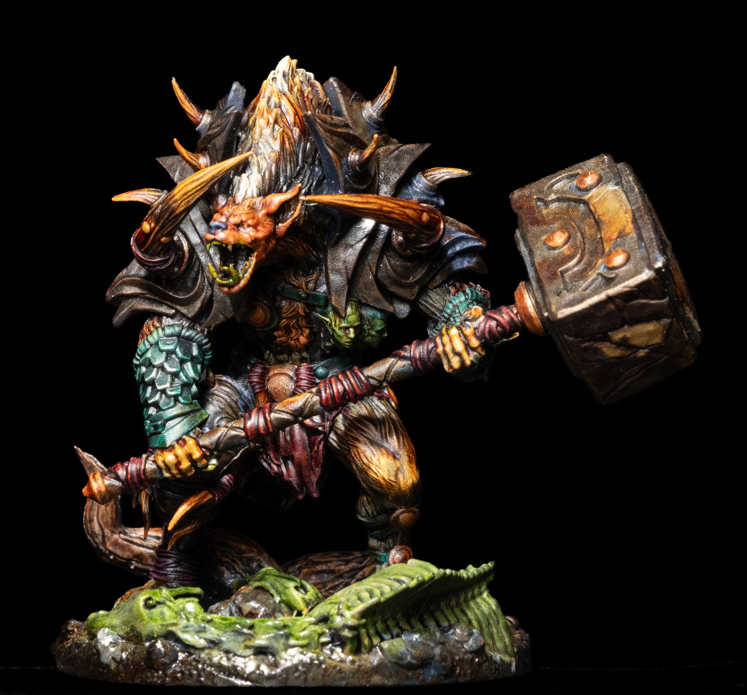 A detailed close-up of a mythical creature figurine with a fierce expression, sharp horns, and intricate armor, standing on a textured base.