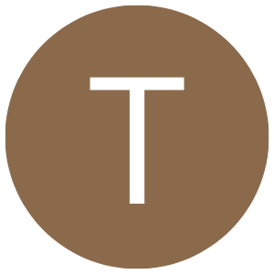 A large brown circle with a white letter T in the center.