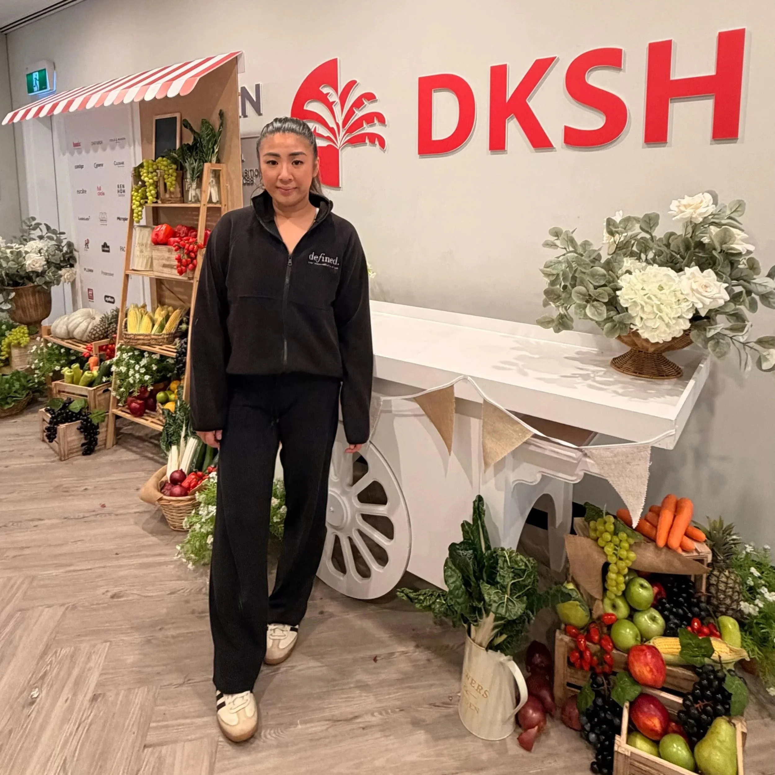 DKSH branded exhibition display featuring fresh produce, floral styling and a custom promotional backdrop at a corporate event.