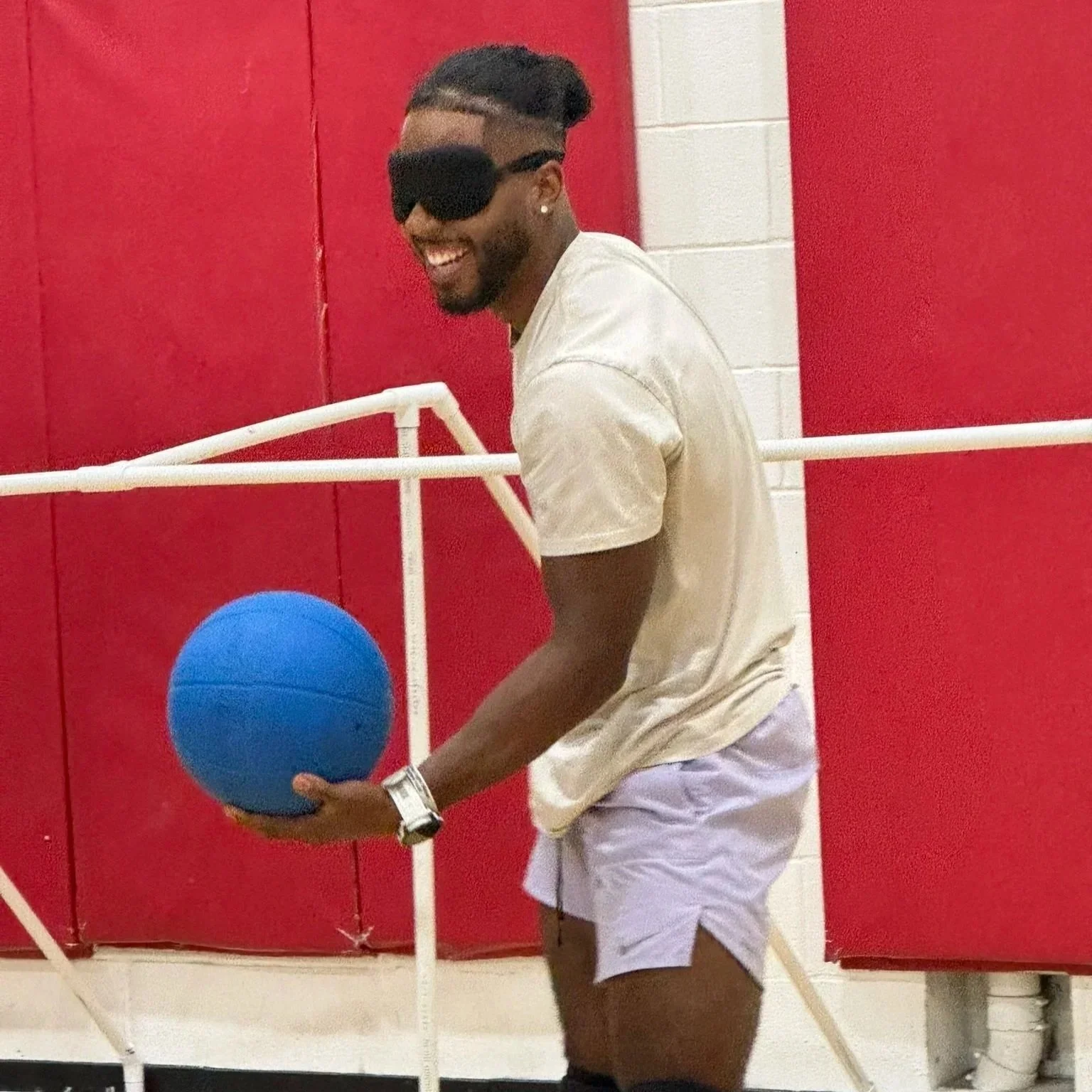 Photo of De'Shaun from Achilles International playing Goalball for the first time in September 2026.